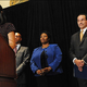 Michelle Rhee announces her resignation as Kaya Hendersonlooks on. (The Washington Post)